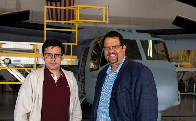 Thomas and Peter in front of an MV-22 aircraft.